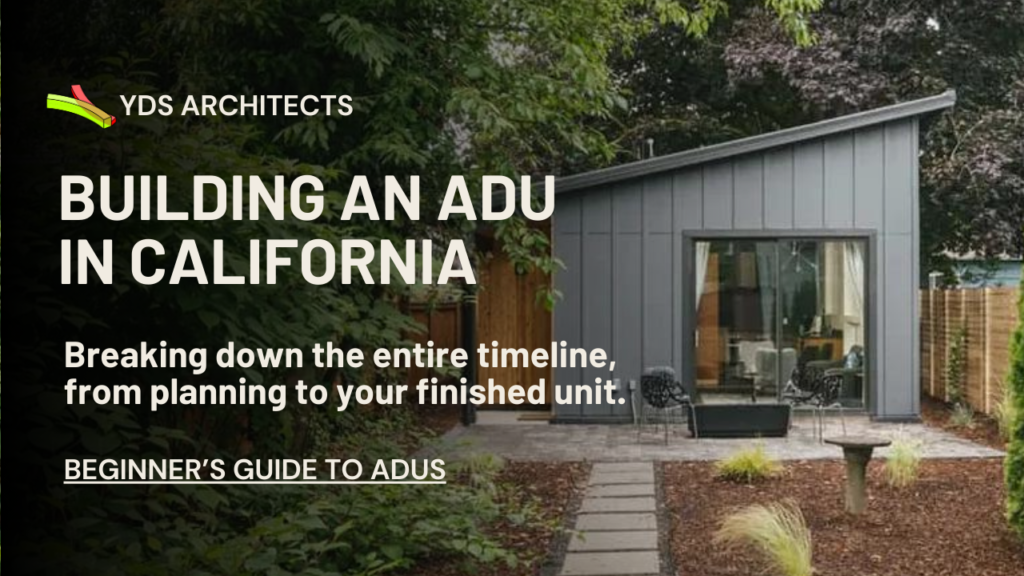 A modern, gray ADU with a slanted roof sits nestled in a backyard with lush greenery. A stone pathway leads to a patio area with outdoor furniture. Text on the image reads "YDS ARCHITECTS, BUILDING AN ADU IN CALIFORNIA, Breaking down the entire timeline, from planning to your finished unit, BEGINNER'S GUIDE TO ADUS."