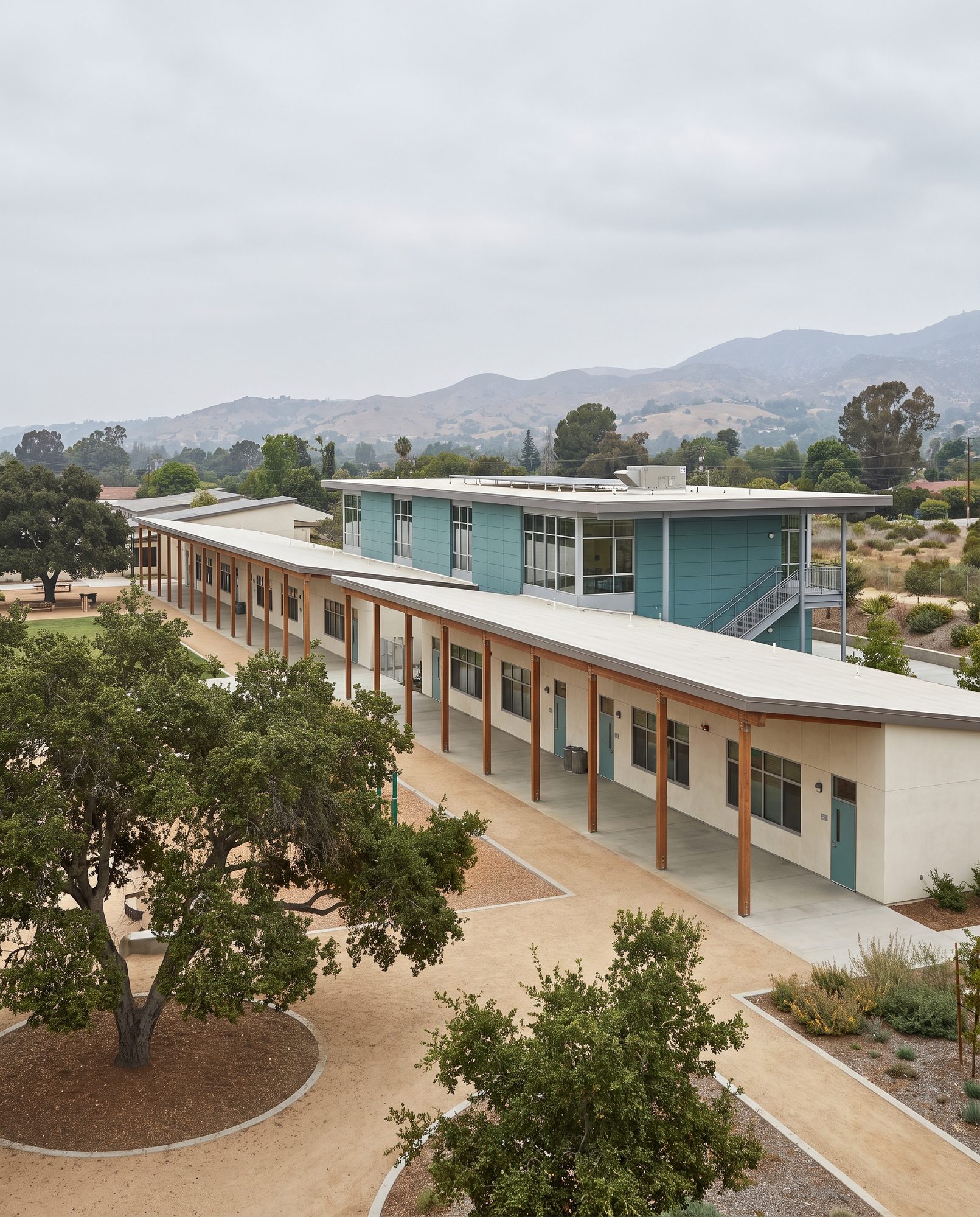 Campus view: classroom wing framing the play yard