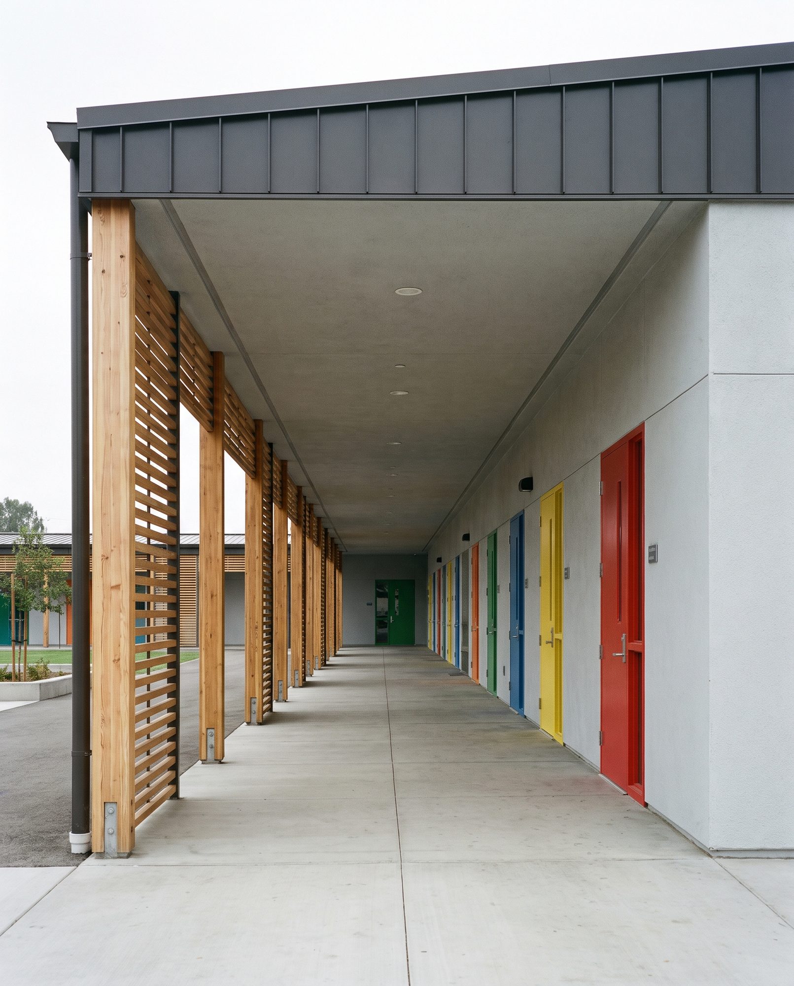Covered exterior corridor along the classroom wing
