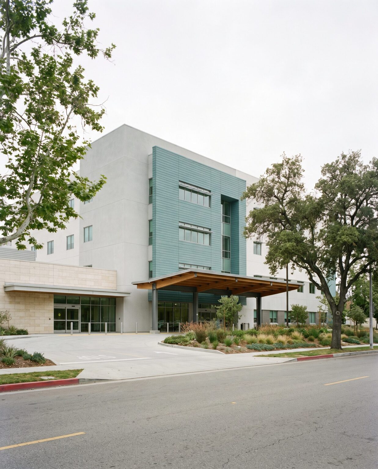 Teal patient wing over a stucco base
