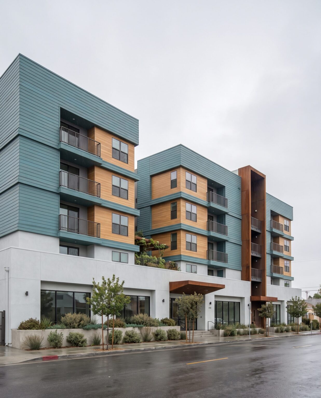 Courtyard 55, stepped residential volumes with balconies over street retail